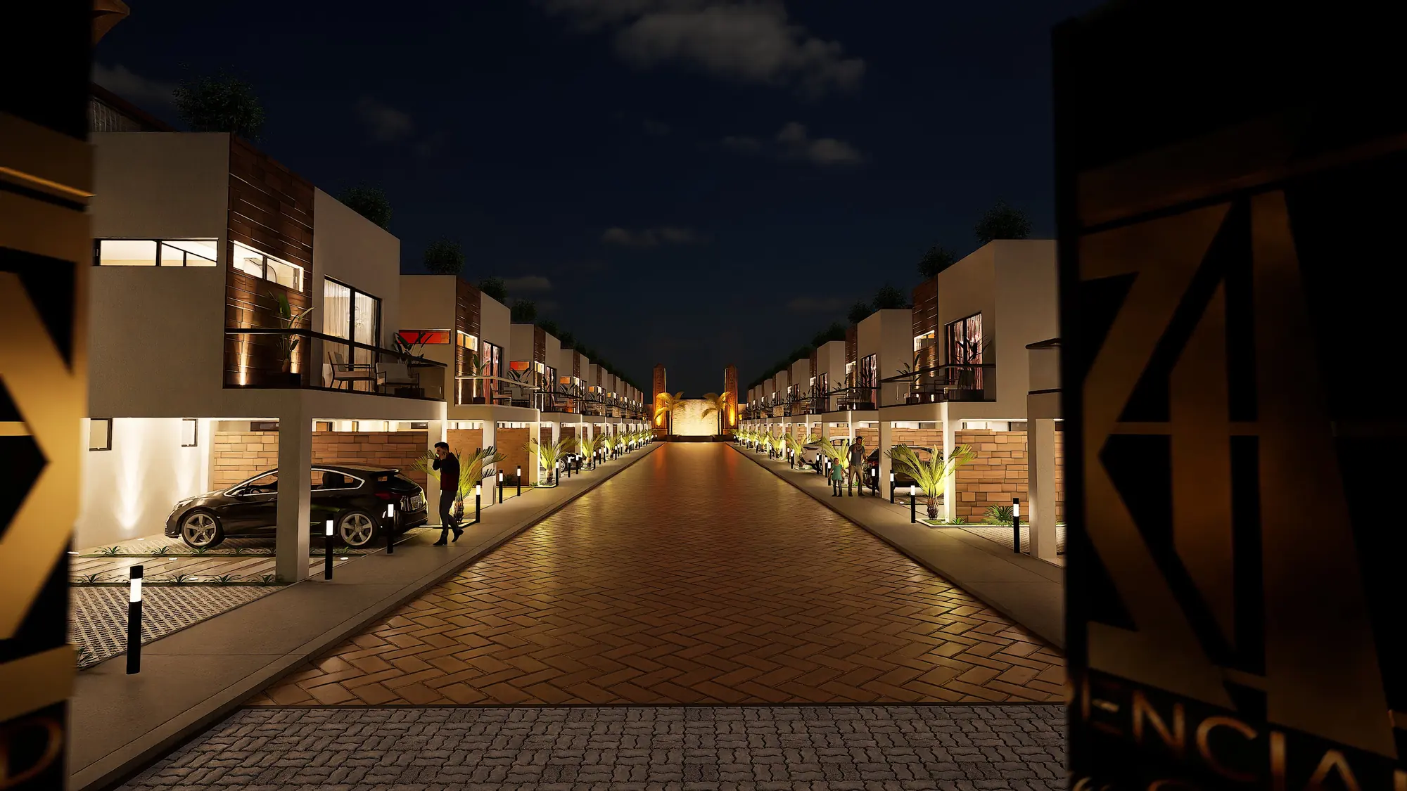 La calle principal de noche vista desde el acceso, con el logotipo de Luxor en primer plano
